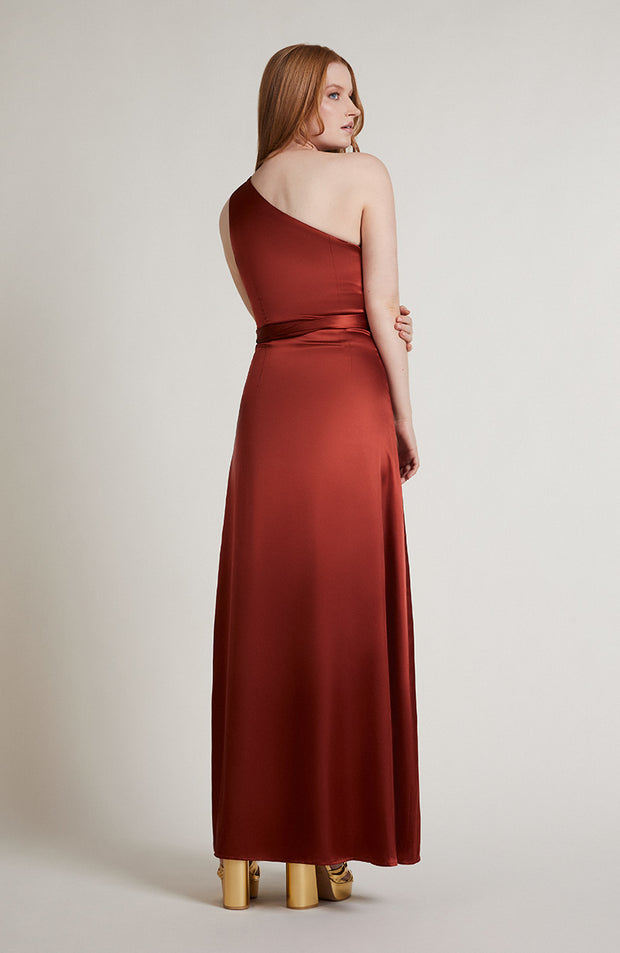 Satin one shoulder bridesmaids dress in burnt orange with a detachable bow. A beautiful rich copper rust colour, this dress is a modern and stylish option for all occasions.