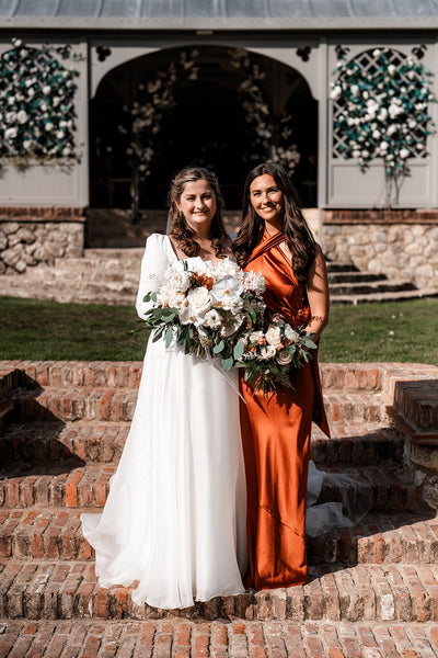 burnt orange satin halterneck bridesmaids dress