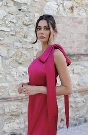 Satin one shoulder bridesmaids dress in hot pink with a detachable bow. A beautiful rich fuchsia magenta pink this dress is a modern and stylish option for all occasions.