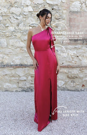 Satin one shoulder bridesmaids dress in hot pink with a detachable bow. A beautiful rich fuchsia magenta pink this dress is a modern and stylish option for all occasions.