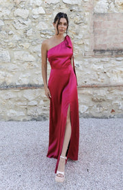 Satin one shoulder bridesmaids dress in hot pink with a detachable bow. A beautiful rich fuchsia magenta pink this dress is a modern and stylish option for all occasions.