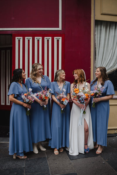 florence wrap bridesmaids dress in cornflower bluebell blue