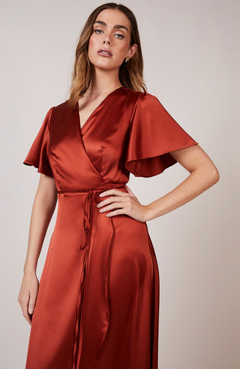 Satin wrap bridesmaids dress in burnt orange with a short sleeve A beautiful rich copper rust colour, this dress is a modern and stylish option for all occasions.