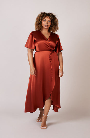 Satin wrap bridesmaids dress in burnt orange with a short sleeve A beautiful rich copper rust colour, this dress is a modern and stylish option for all occasions.