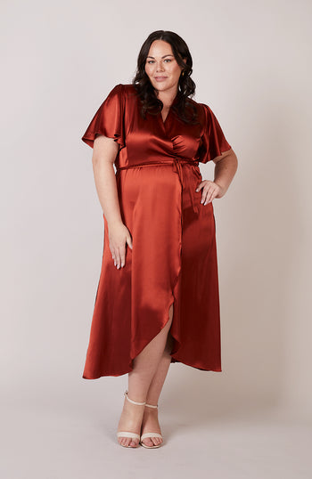 Satin wrap bridesmaids dress in burnt orange with a short sleeve A beautiful rich copper rust colour, this dress is a modern and stylish option for all occasions.