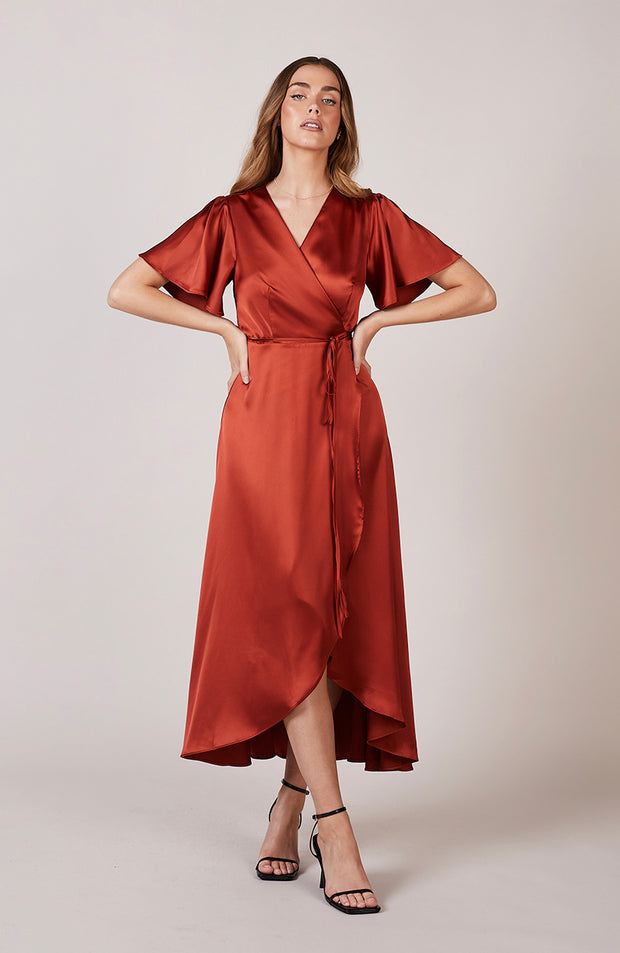 Satin wrap bridesmaids dress in burnt orange with a short sleeve A beautiful rich copper rust colour, this dress is a modern and stylish option for all occasions.