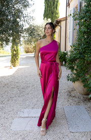 Satin one shoulder bridesmaids dress in hot pink with a detachable bow. A beautiful rich fuchsia magenta pink this dress is a modern and stylish option for all occasions.