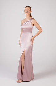 Satin one shoulder bridesmaids dress in rose pink with a detachable bow. A beautiful rich candy floss blush pink this dress is a modern and stylish option for all occasions.