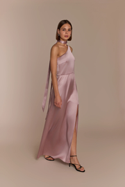 Woman wearing a rose pink satin one shoulder gown