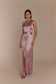 Woman wearing a rose pink satin one shoulder gown