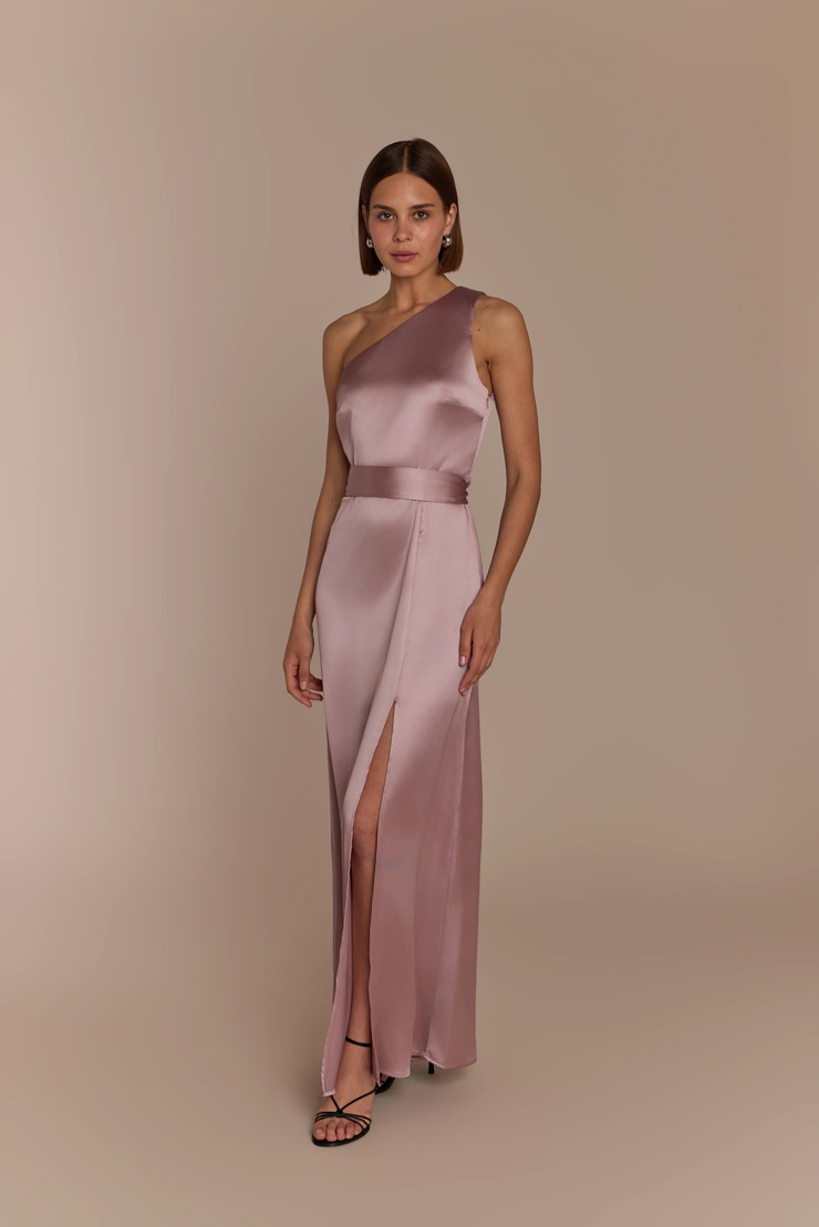 Woman wearing a rose pink satin one shoulder gown