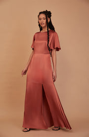 Satin full length flutter sleeve bridesmaids dress in Terracotta in environmentally friendly fabric with a side split. A beautiful rich cinnamon rose gold colour.