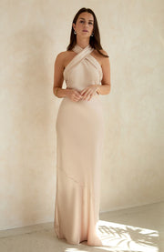 Champagne satin halterneck bridesmaids and black tie wedding guest occasion wear dress.