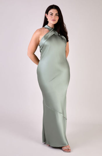 Woman wearing a green evening gown on a white background